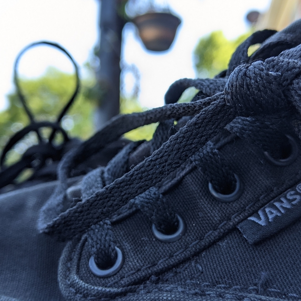 Black lace-up Vans